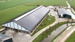Aeroplane view of a factory surrounded by grass
