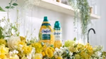 Two new Comfort innovations on a washing machine surrounded by flowers.