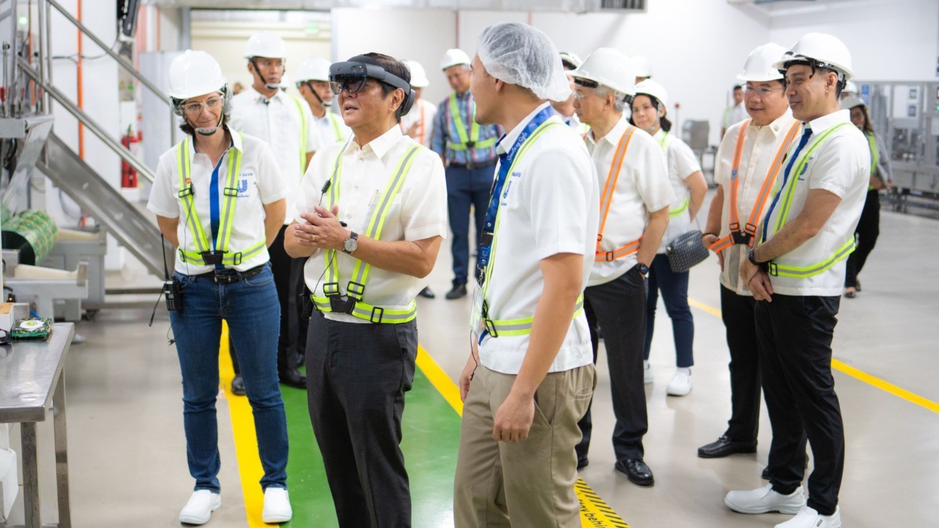 Philippines President Ferdinand Marcos tries out a VR diagnostic tool used at Unilever Philippines new factory in Cavite