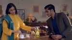 Image of young couple at a kitchen counter
