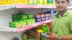 Retailer using app on a smartphone to check stock