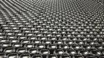 Rows of black cans arranged close together
