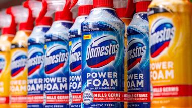 Line of Domestos Power Foam bottles on supermarket shelf. The Domestos brand sits within Unilever’s Home Care business group.