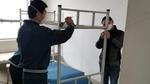 Image of two men putting up a bunk bed