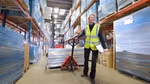 Photo of female warehouse worker in factory