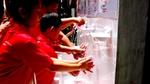A group of children raise their hands whilst taking part of Lifebuoy’s handwashing programme