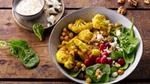 Image of cauliflower in a bowl full of vegetables.