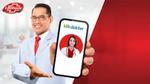 Man holding up phone. The doctor he has an online appointment with is seen on the phone’s screen