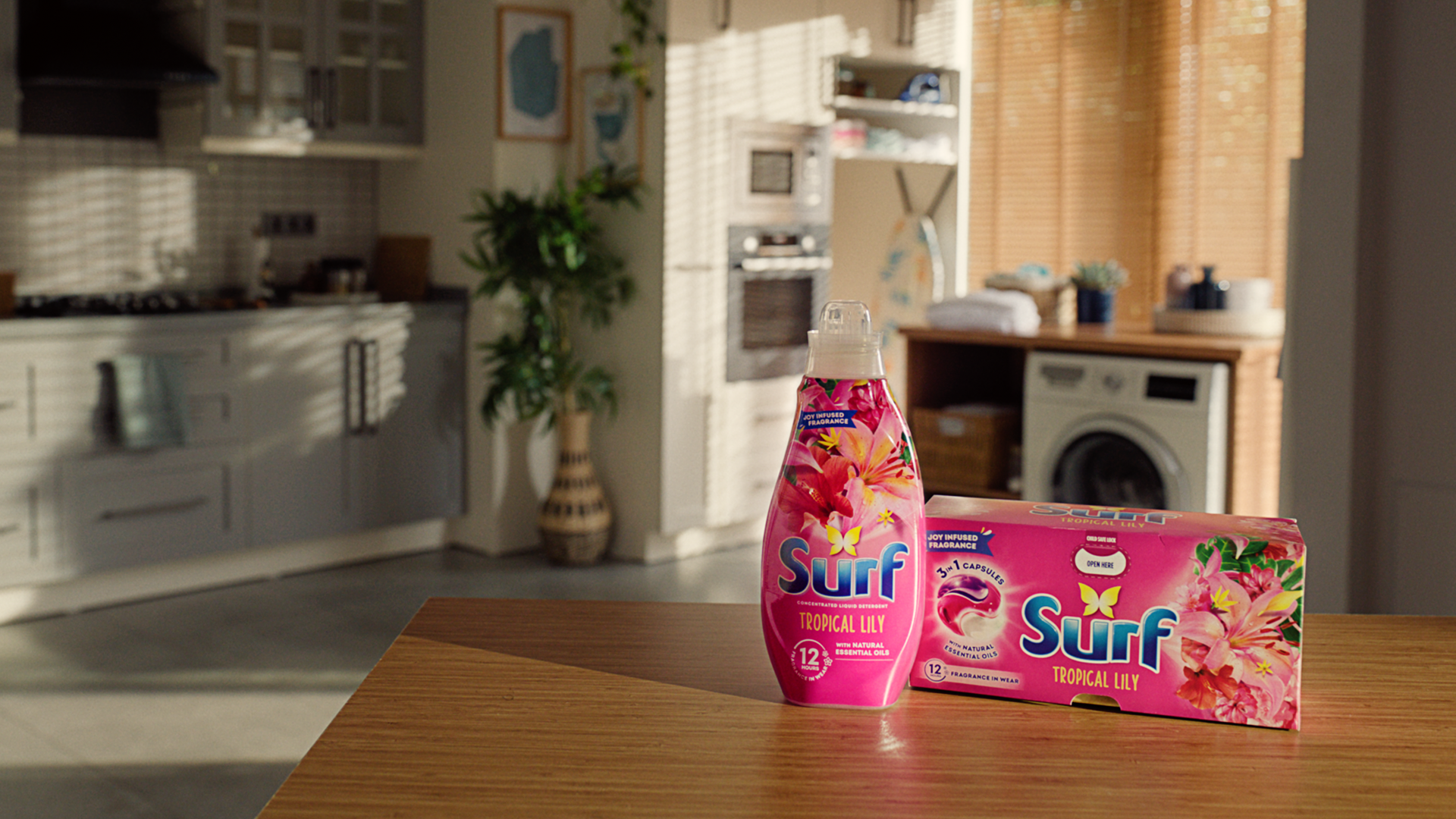 Two Surf products on a kitchen counter, with a washing machine, a row of cupboards and a plant in the background.