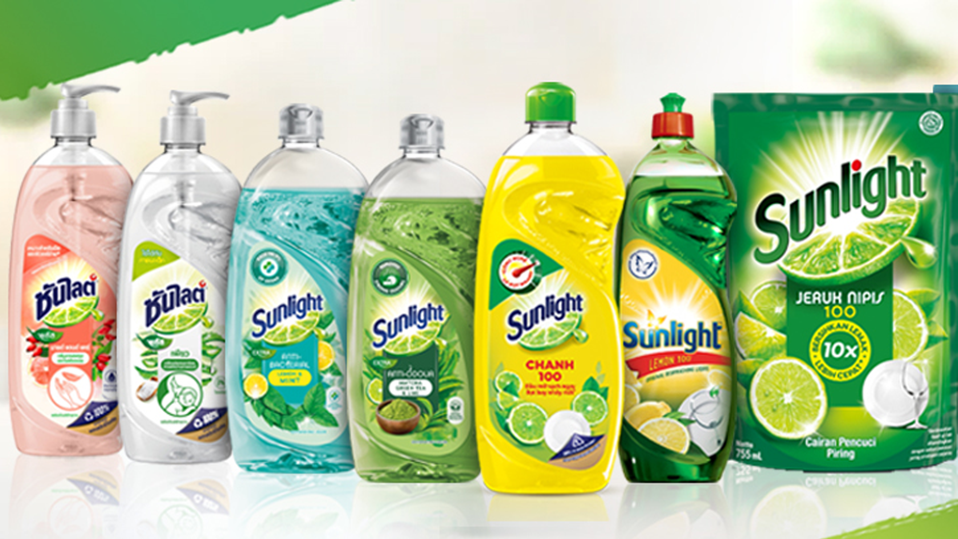 A selection of Sunlight bottles, tablets and packages with a sunburst in the background. 