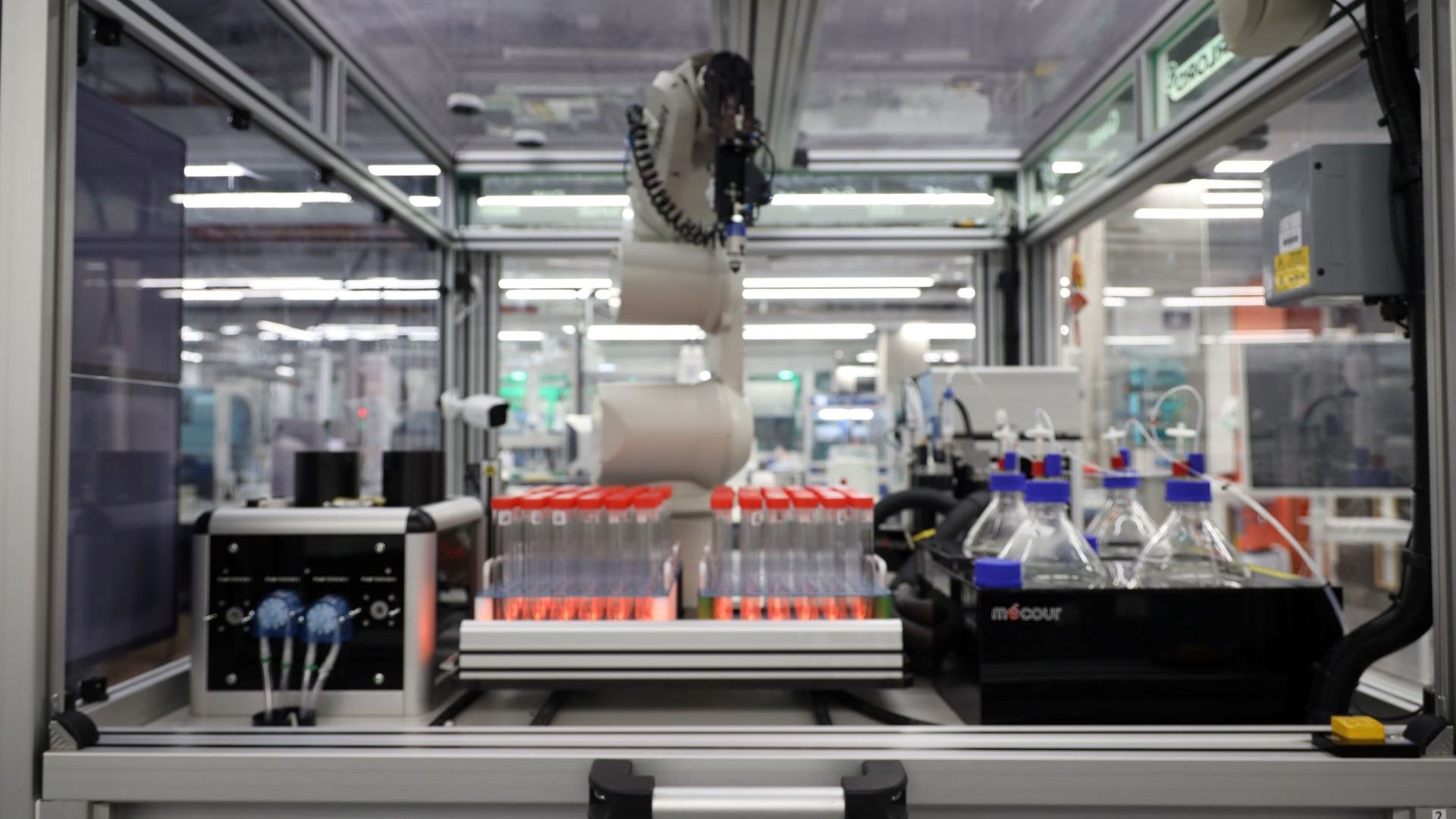 A robot with test tubes in the Materials Innovation Factory.