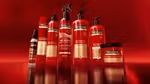 An image of red sprays, bottles and packs from Unilever’s TRESemmé hair care range, created using digital twin technology.