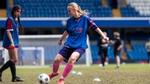 Young girl playing football as part of the Rexona’s Breaking Limits Programme at Chelsea Pitch day event.
